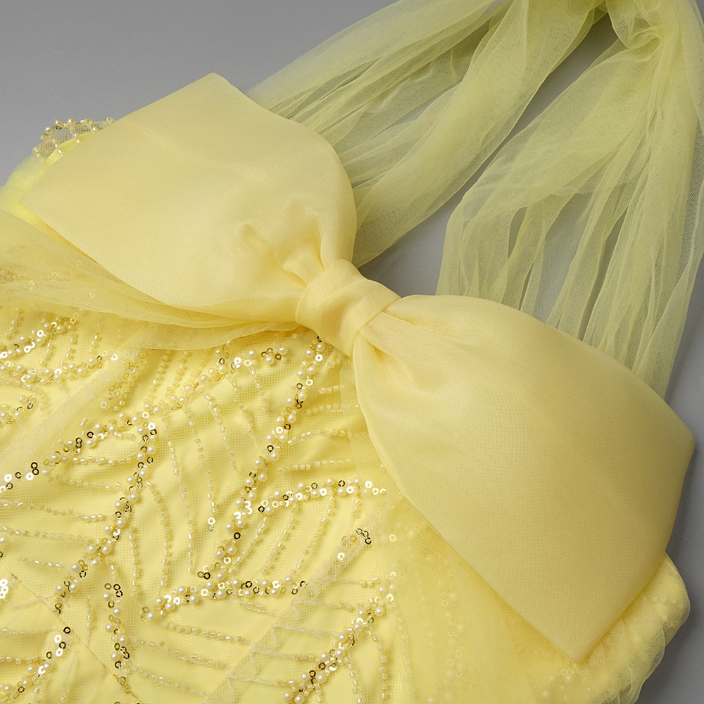 Vintage Fashion Exhibition - فستان سهرة أصفر عتيق بتصميم حورية